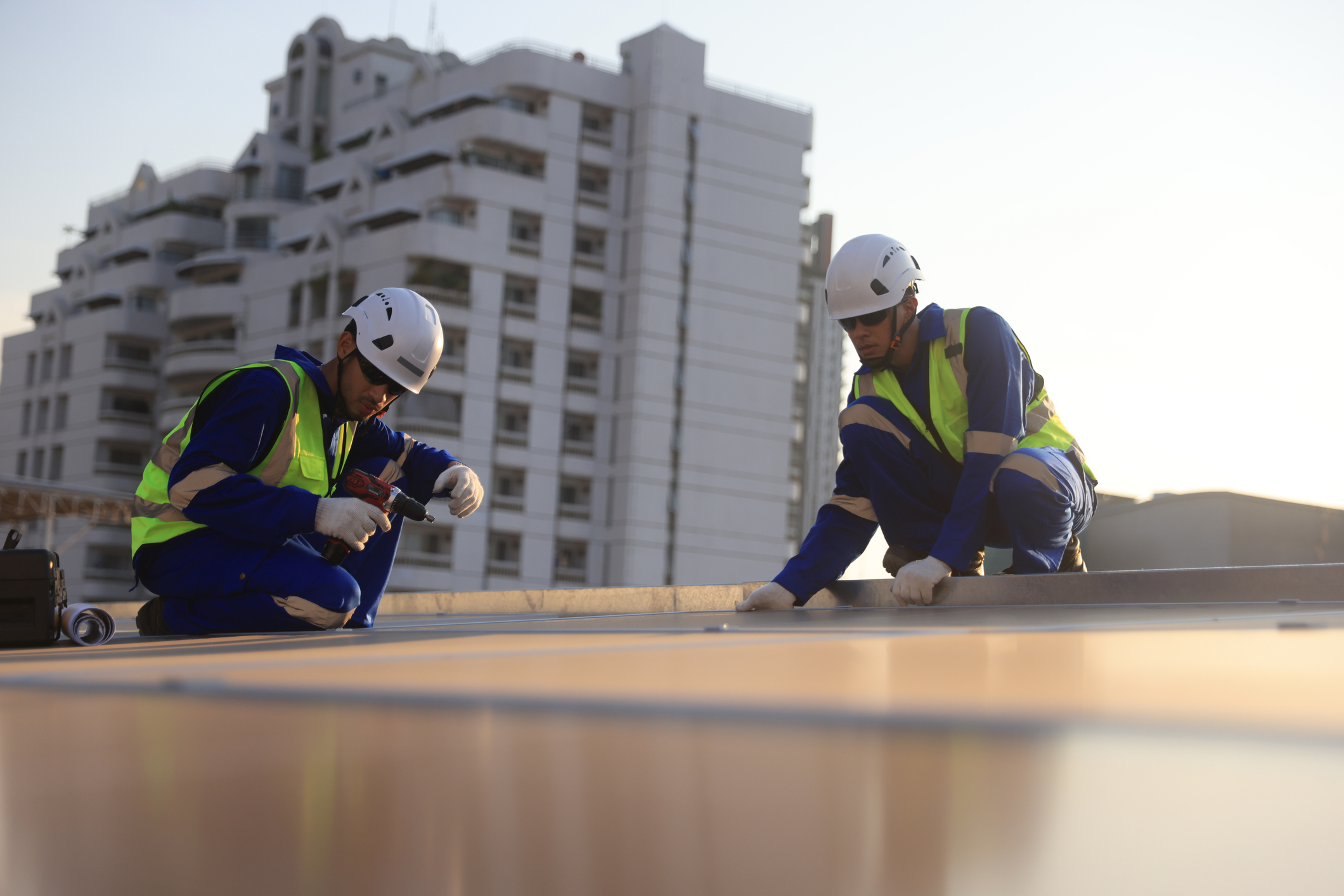aerial-view-of-solar-engineers-on-roof