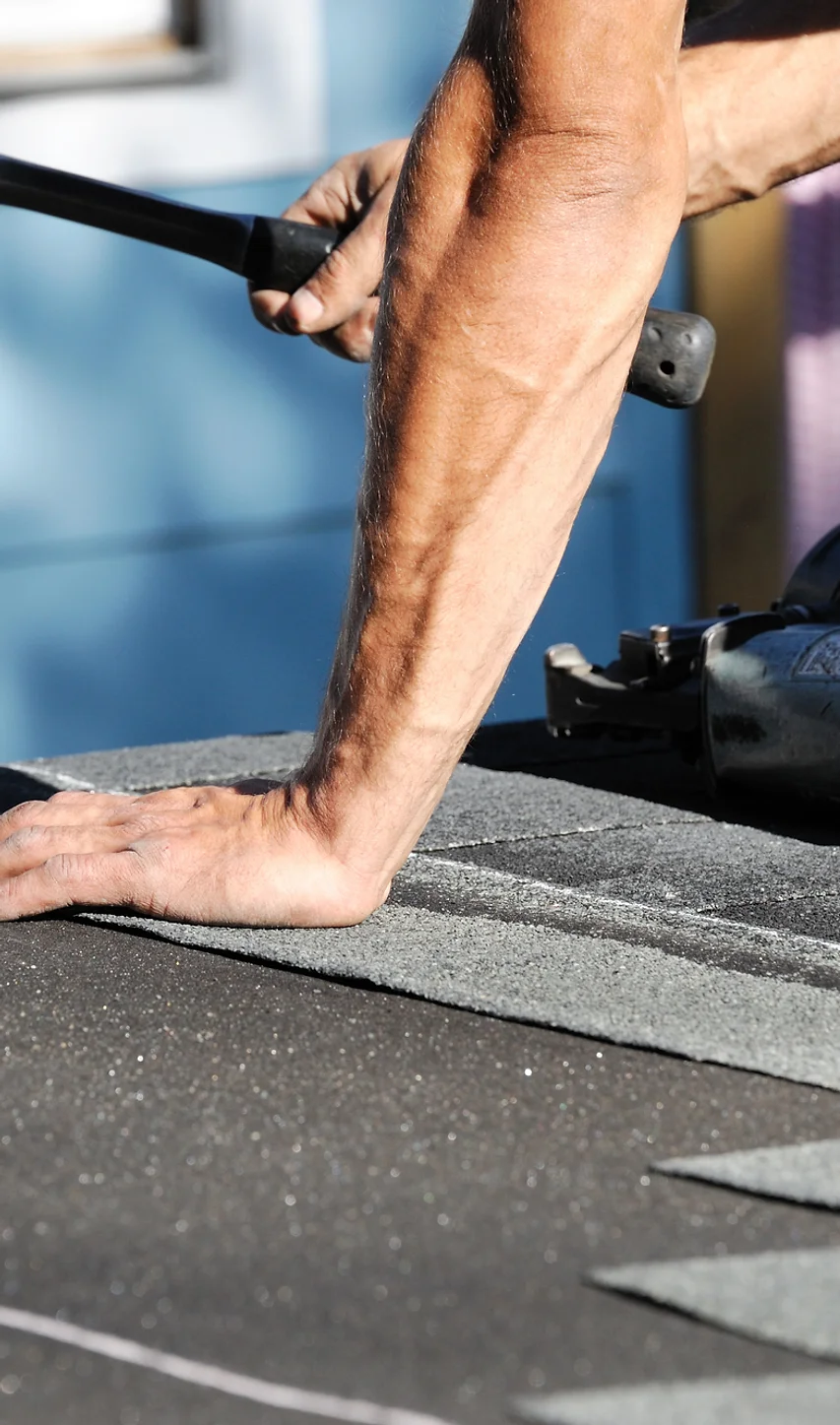 close-up-of-roofer-repairing-shingles-1