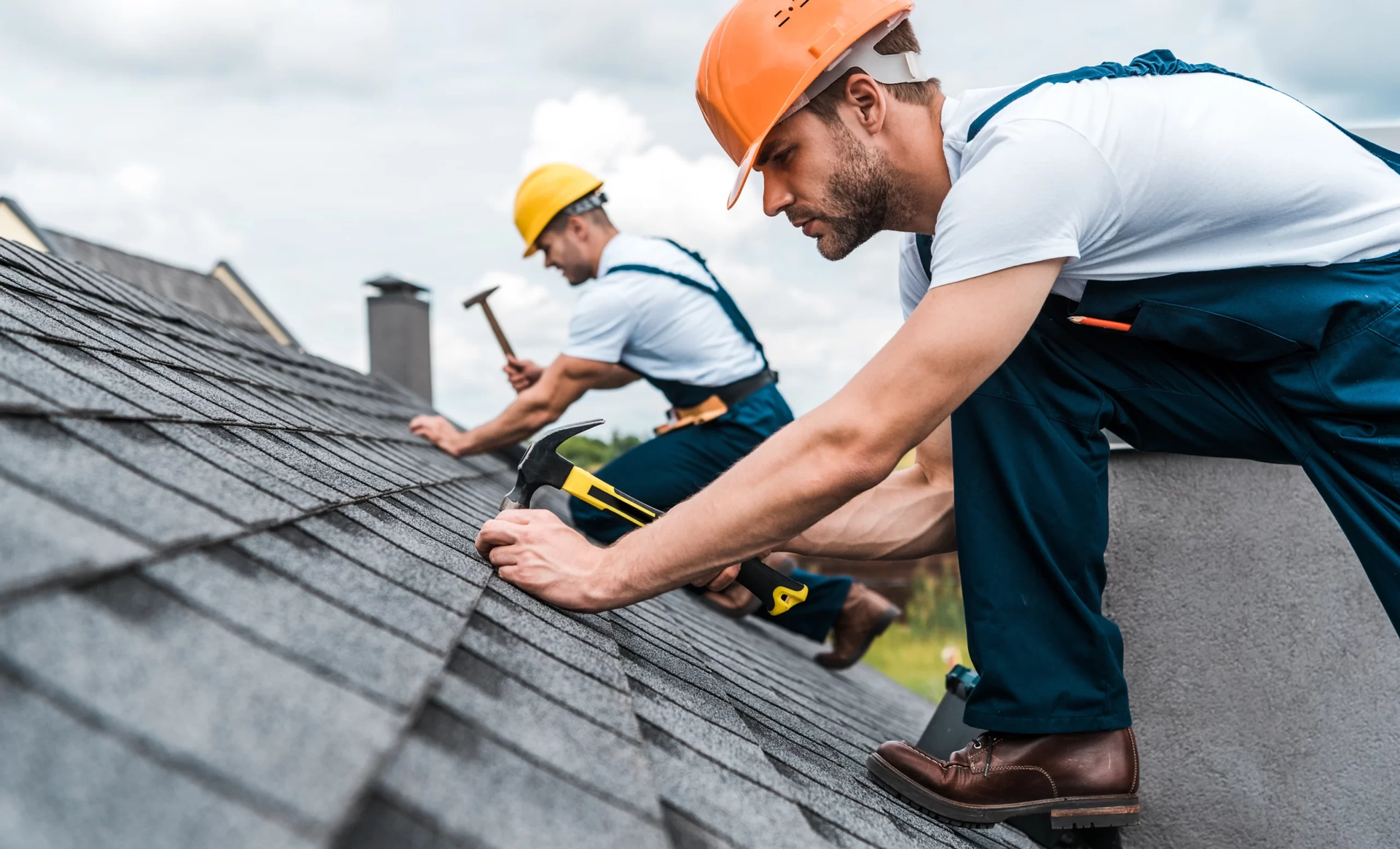 two-roofers-repairing-roof-1-scaled