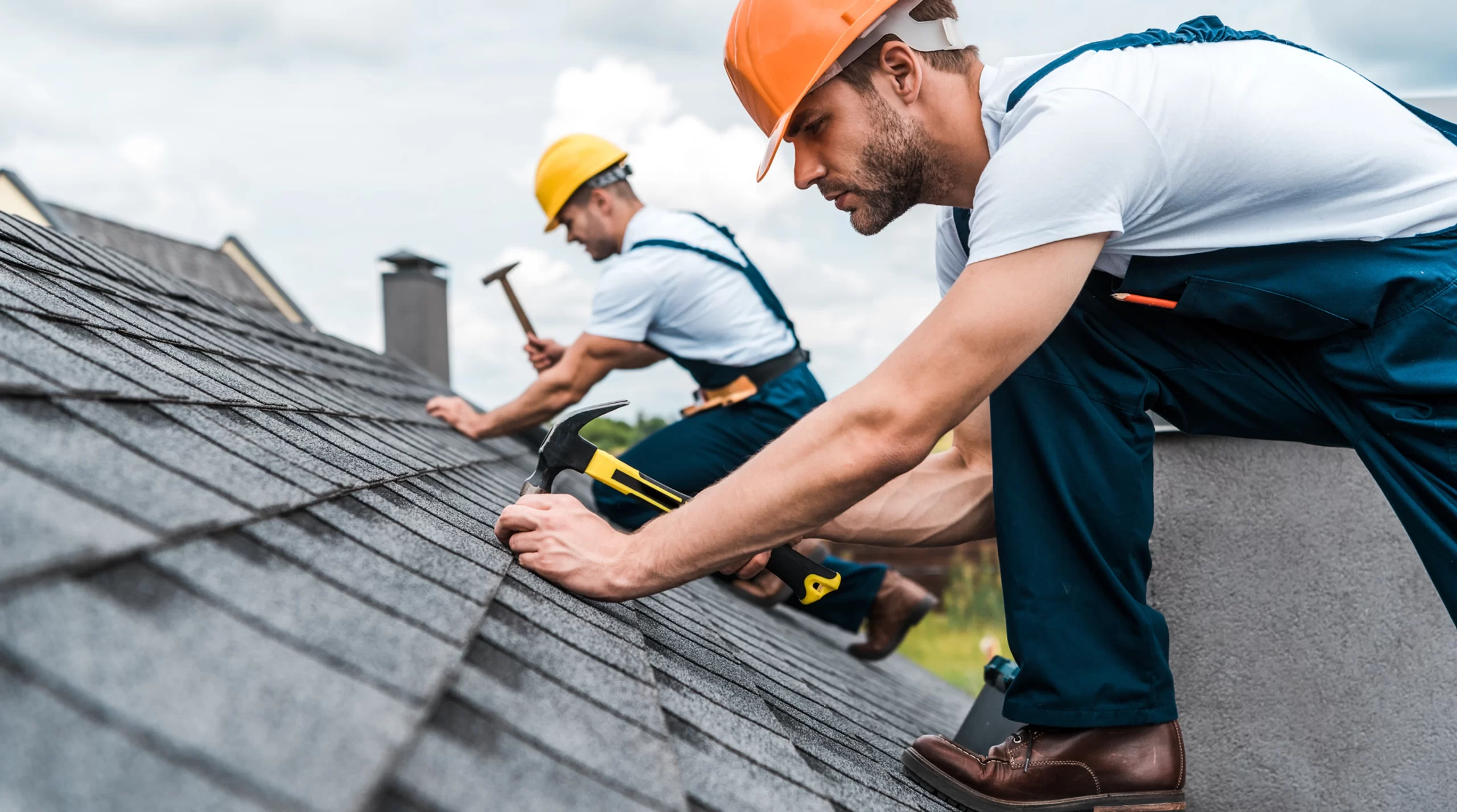 two-roofers-repairing-roof-scaled