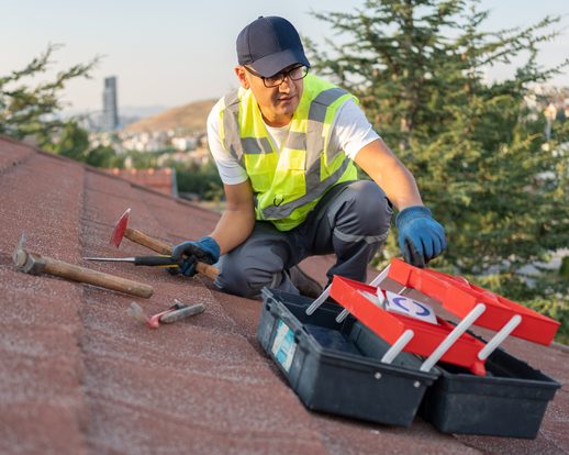 roofer-builder-doing-roof-maintenance