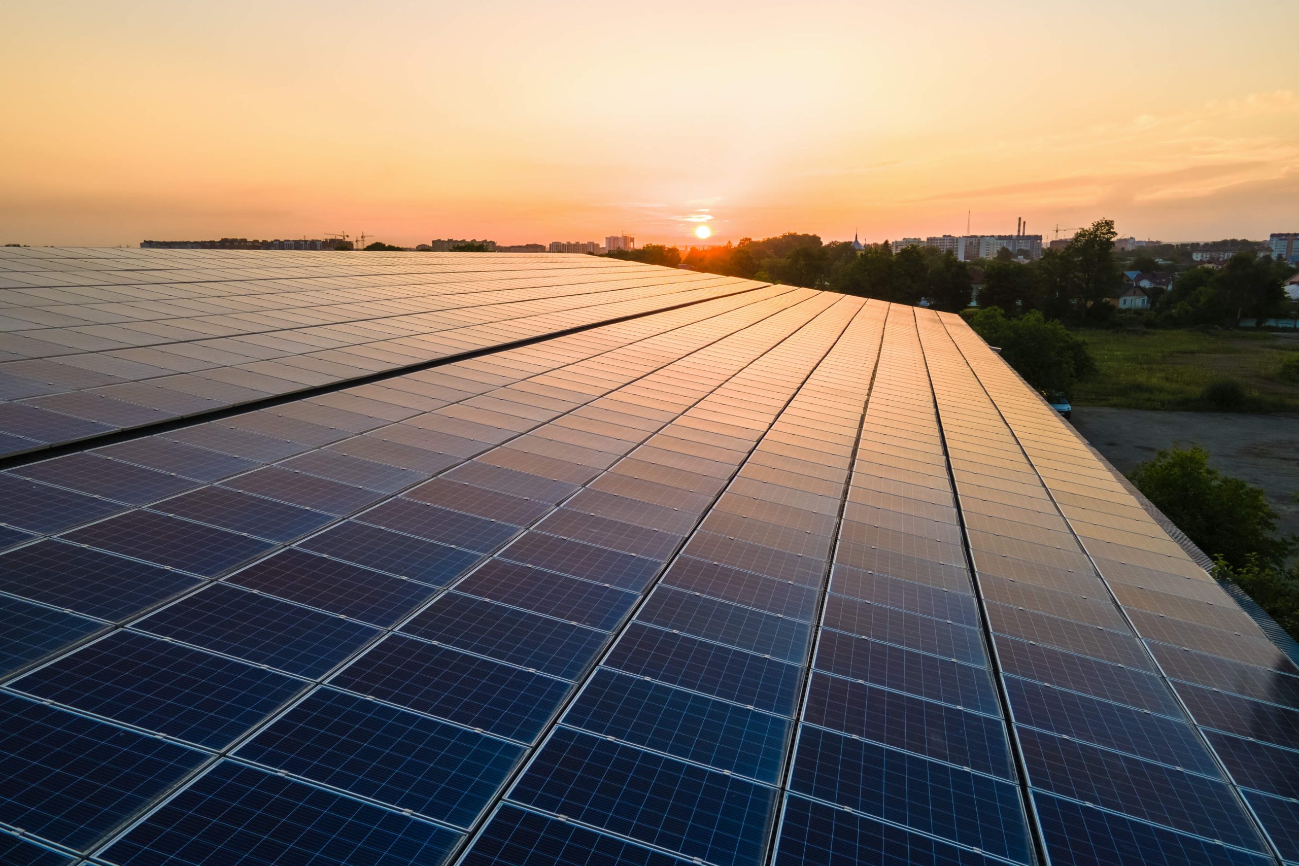 solar-panels-on-building-roof-scaled